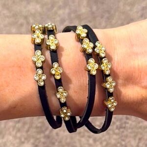 Black Bracelet with Gold Floral Accents and Magnetic Closure